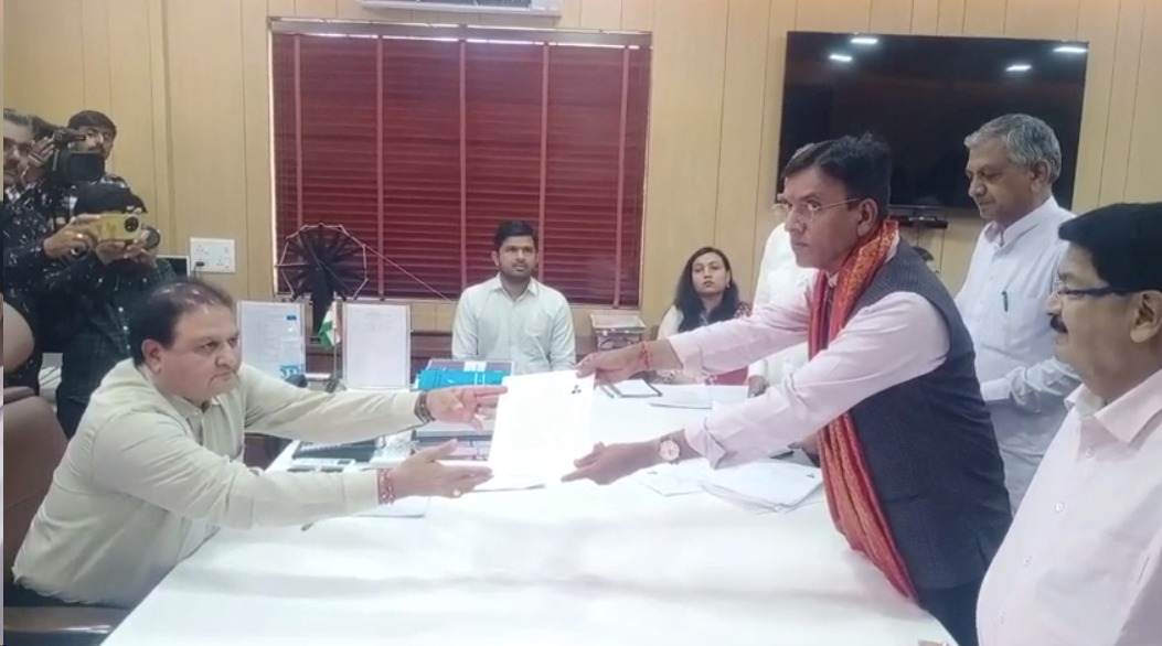 Dr. filling the nomination form with the confidence of winning with a lead of 5 lakhs. Mansukh Mandvia