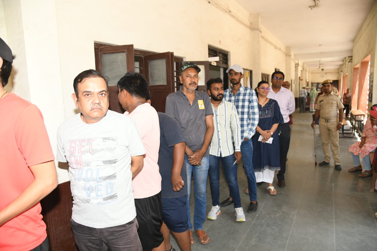 Rajkot District Collector voted as a common voter standing in a queue