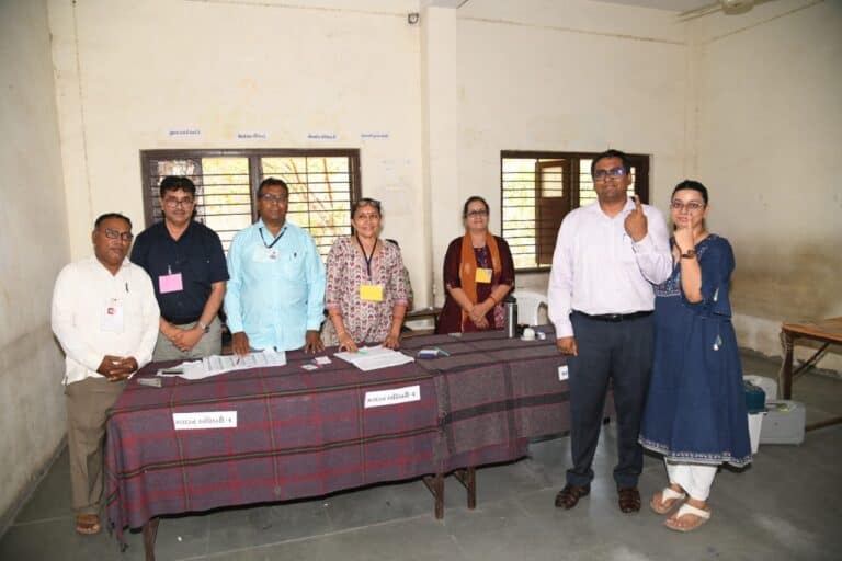 Rajkot District Collector Voted As A Common Voter Standing In A Queue